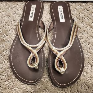 Steve Madden brown with metallic strap flip flops